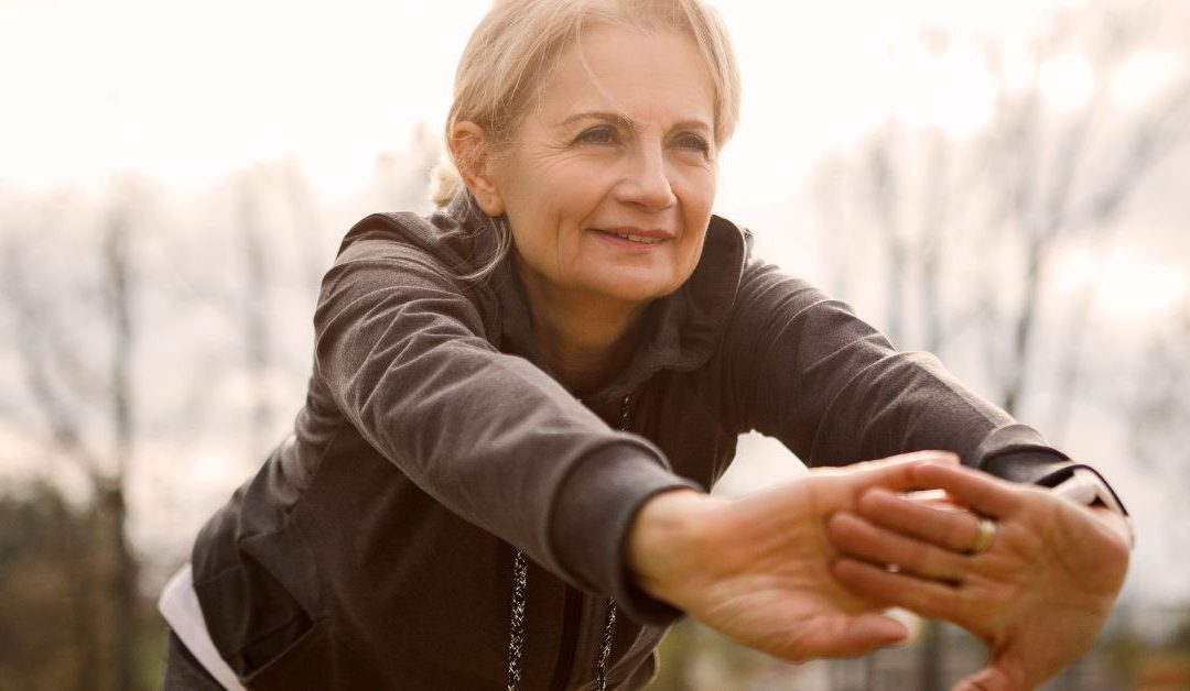 Mature woman exercising outdoors